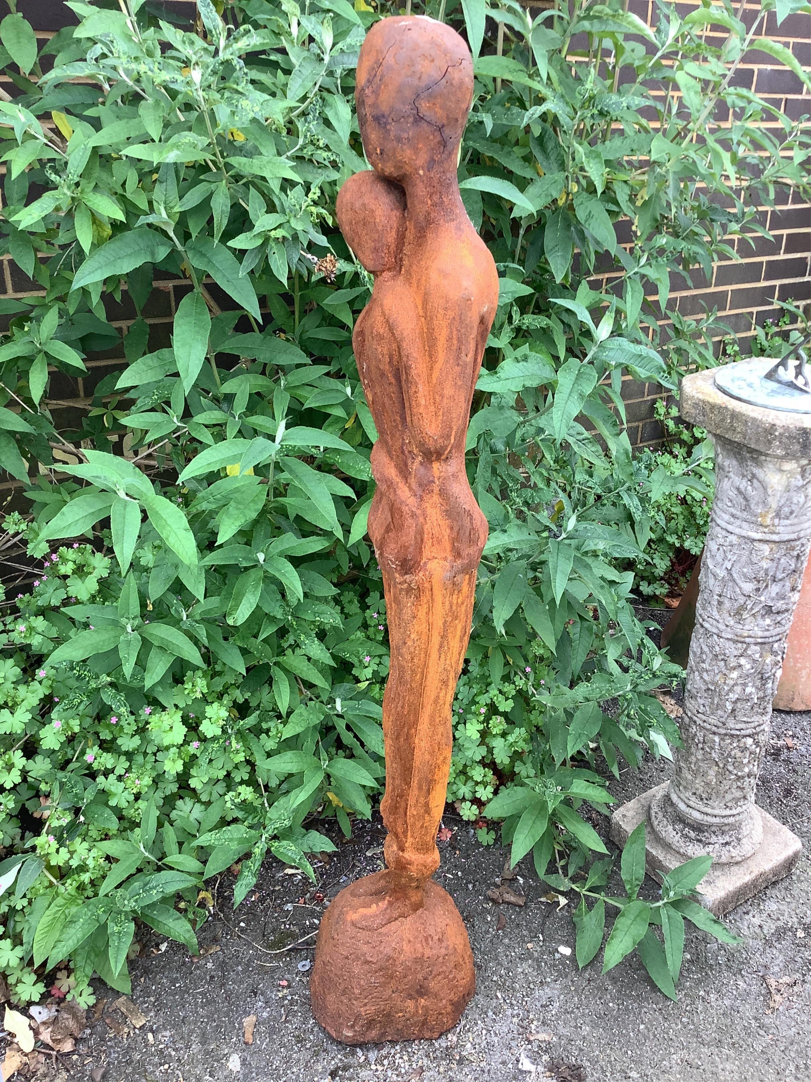 A cast iron embracing couple garden ornament, height 126cm